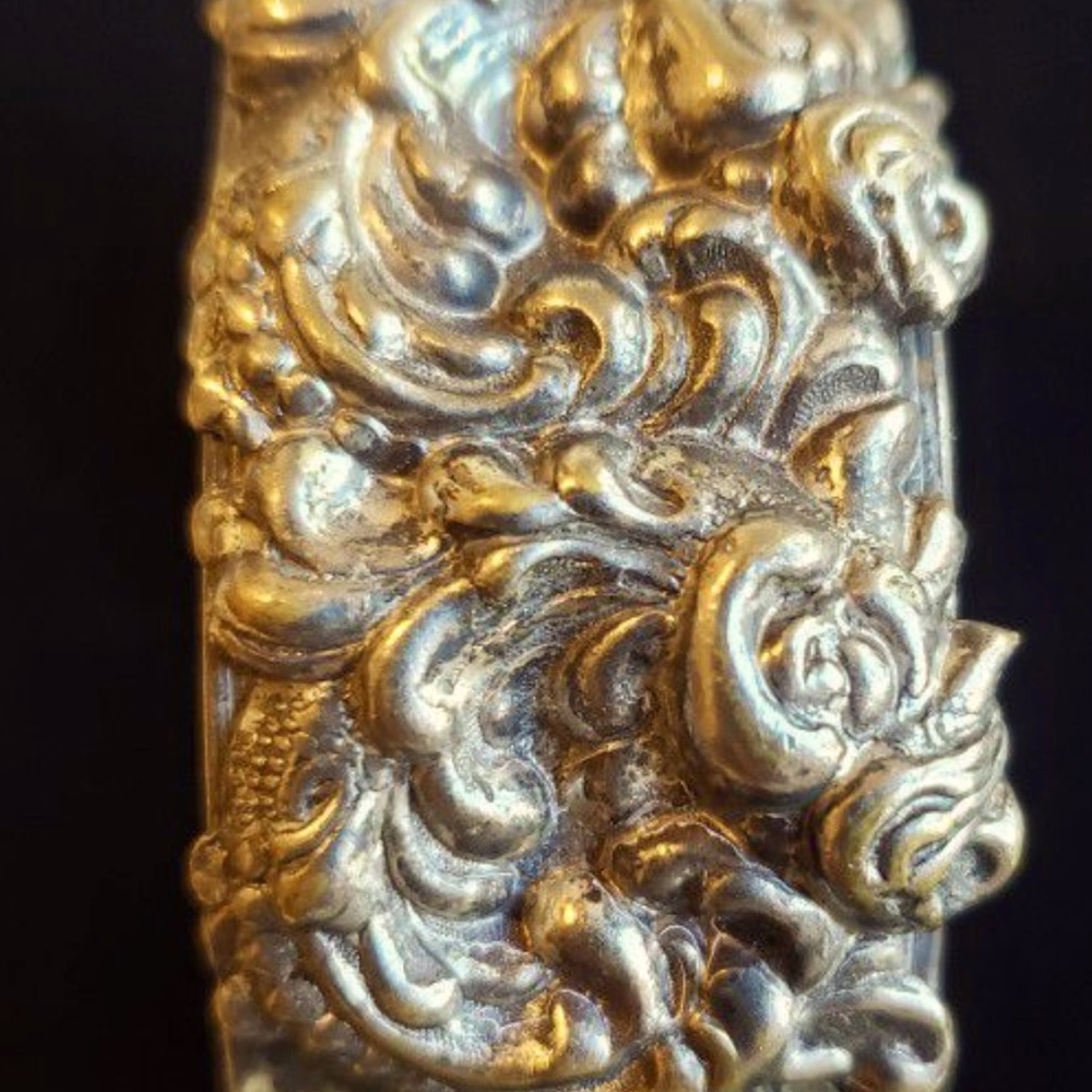 Antique art nouveaurepousse metal bracelet. Ornate Repousse Metal scrollwork.